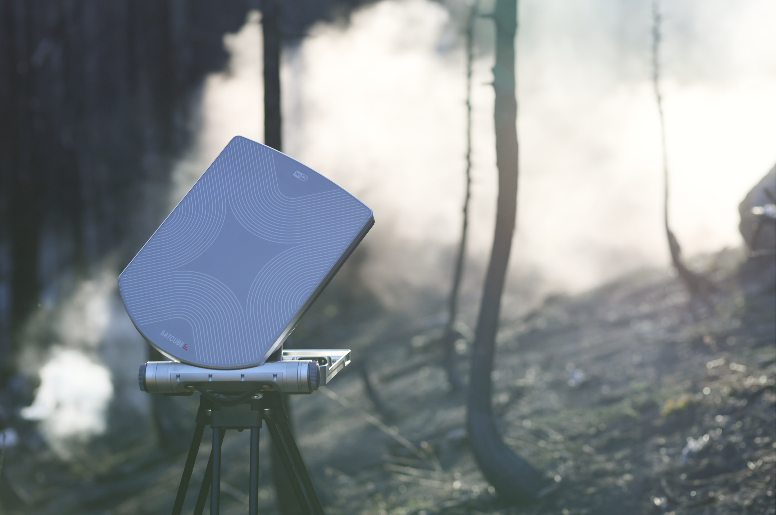Satcube terminal in a smoky forest